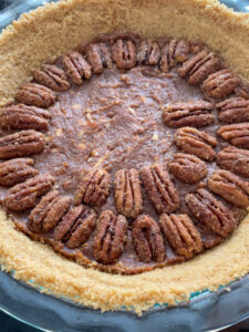 This Healthy Maple Pecan Pie is naturally sweetened and makes a delicious dessert for your table! It can be made vegan and gluten-free with swapping butter for coconut oil and using gluten-free graham crackers or cookies for the pie crust.